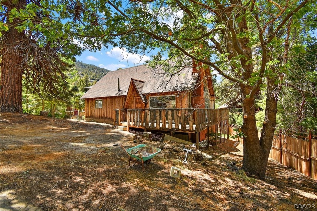 a view of a house with a tree in the background