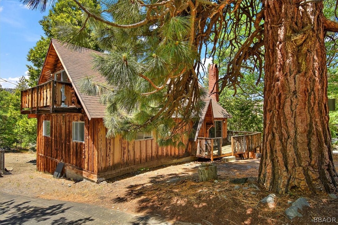 420 Lark Road Wrightwood, CA 92397 - Photo 22 of 25 a view of backyard with wooden fence and large trees