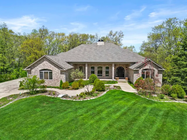 a front view of a house with a yard and porch