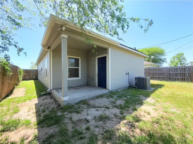 a view of a back yard of the house