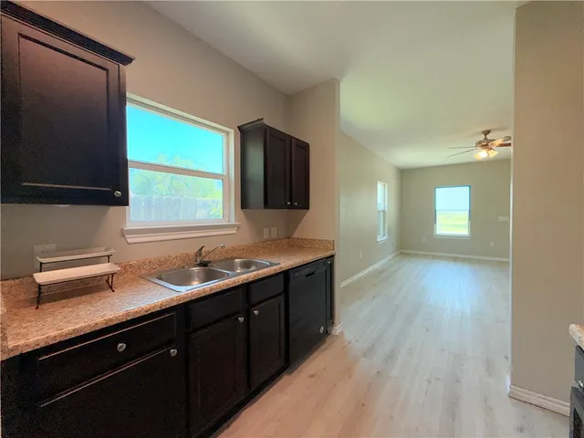 a kitchen with a sink and a window