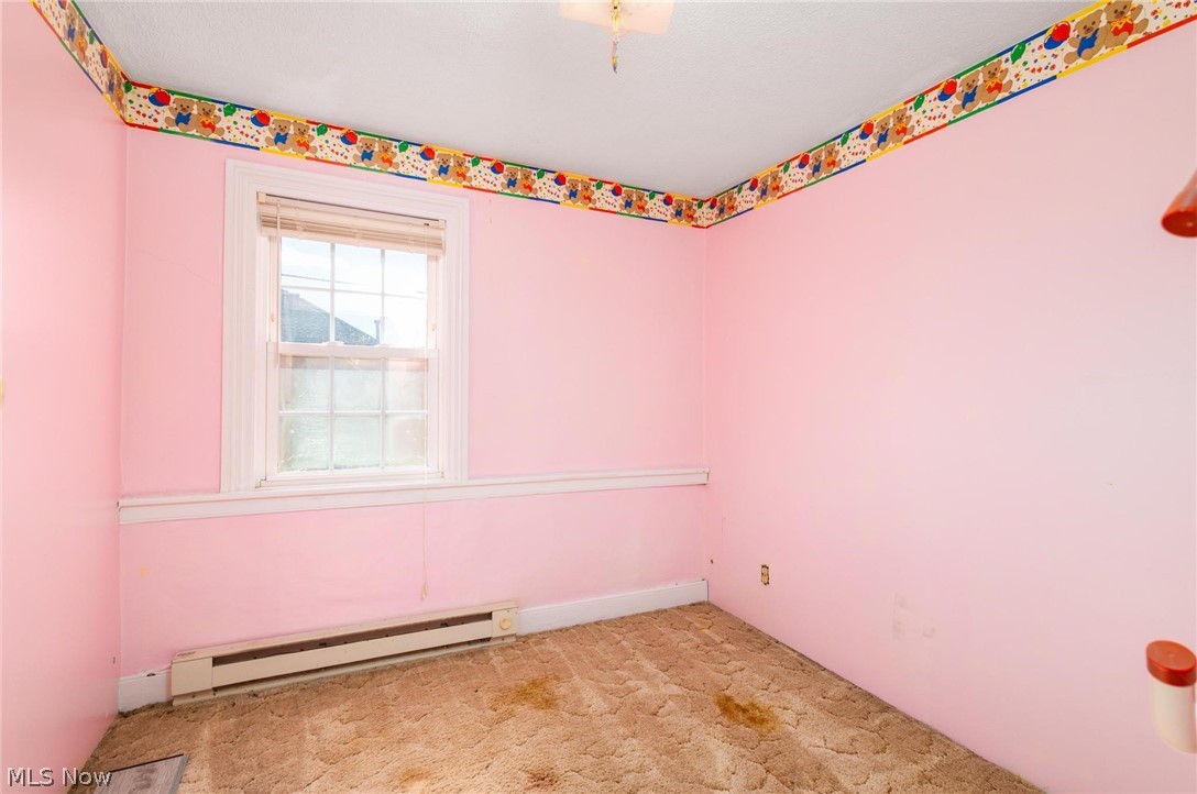 165 9th Street Wellsburg, WV 26070 - Photo 31 of 37 Unfurnished room with a baseboard radiator and light colored carpet