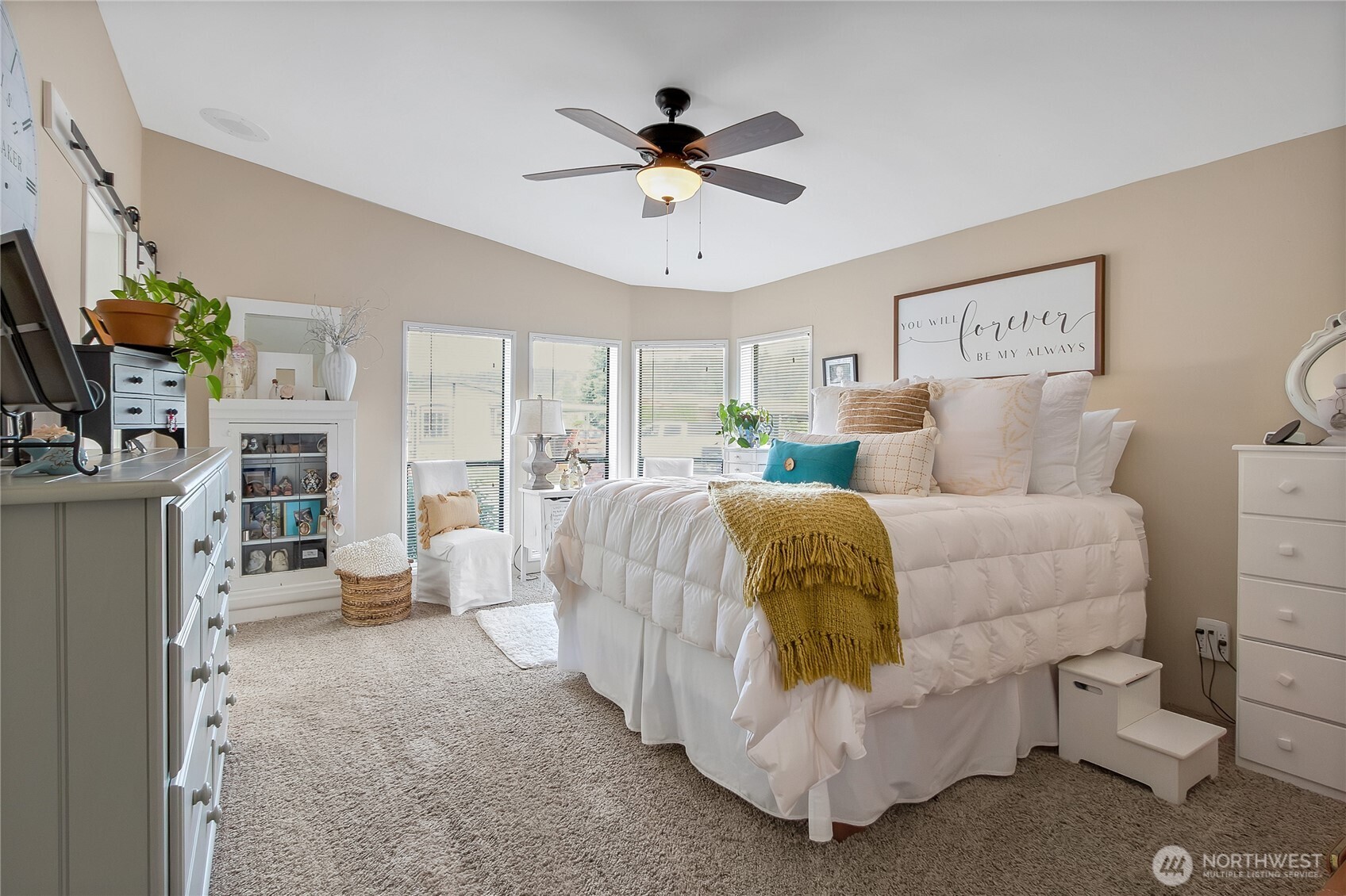 836 Harman Way South, Unit 76 Orting, WA 98360 - Photo 15 of 21 a bed room with a bed and a couch