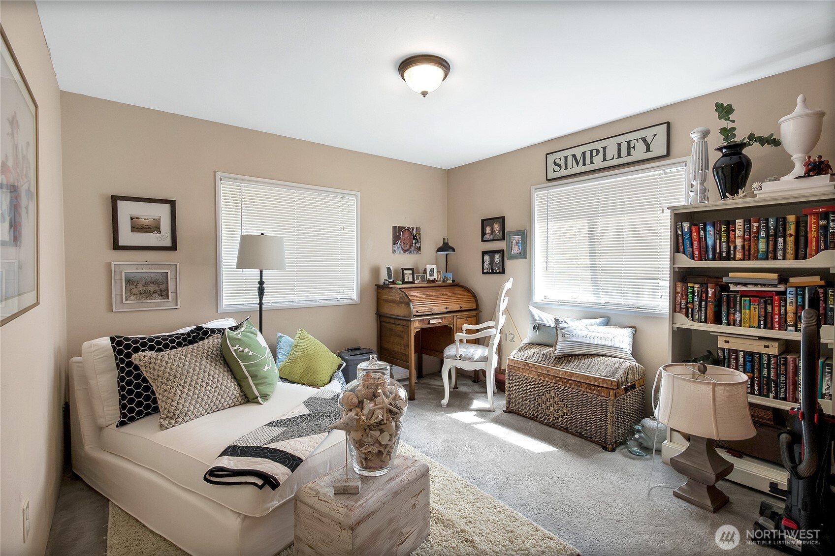 836 Harman Way South, Unit 76 Orting, WA 98360 - Photo 20 of 21 a living room with furniture cabinets and a book shelf