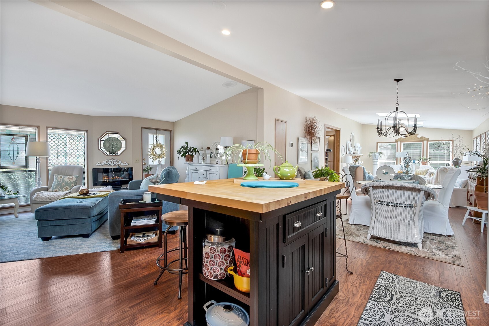 836 Harman Way South, Unit 76 Orting, WA 98360 - Photo 6 of 21 a kitchen with a stove and wooden floor