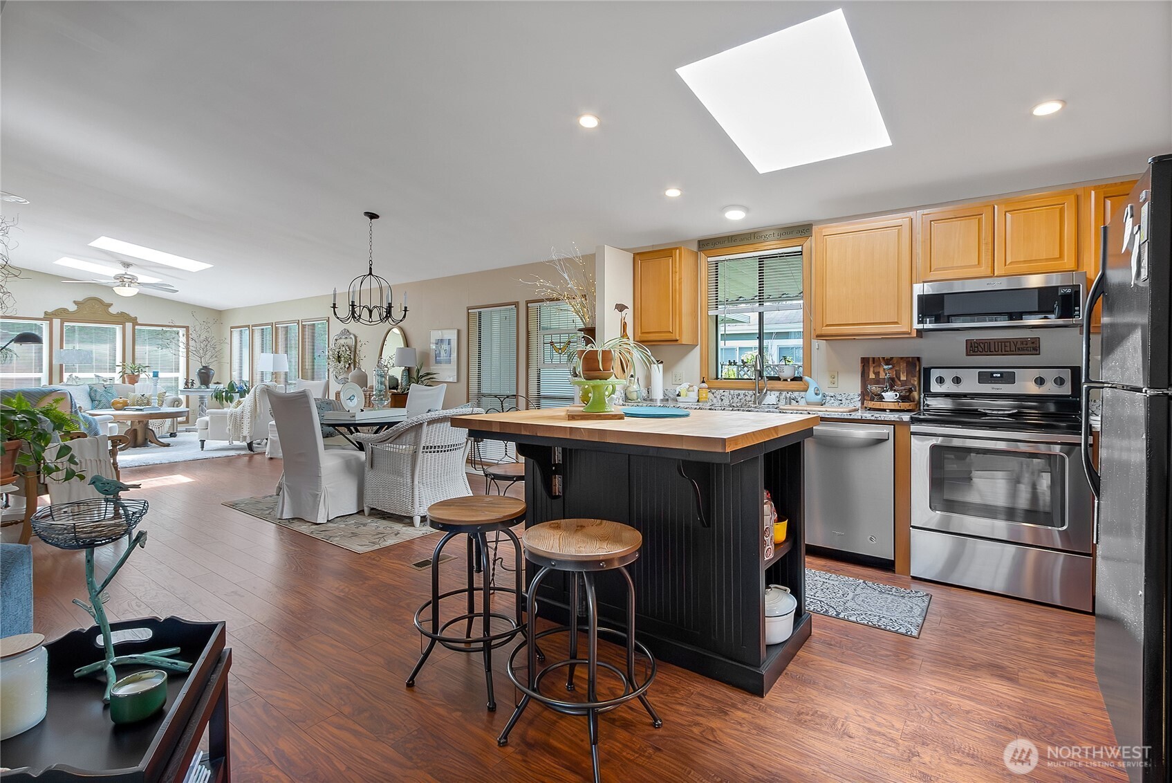 836 Harman Way South, Unit 76 Orting, WA 98360 - Photo 10 of 21 a kitchen with counter space appliances and a dining table