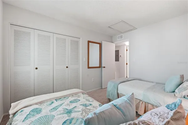 a bedroom with a bed and a closet