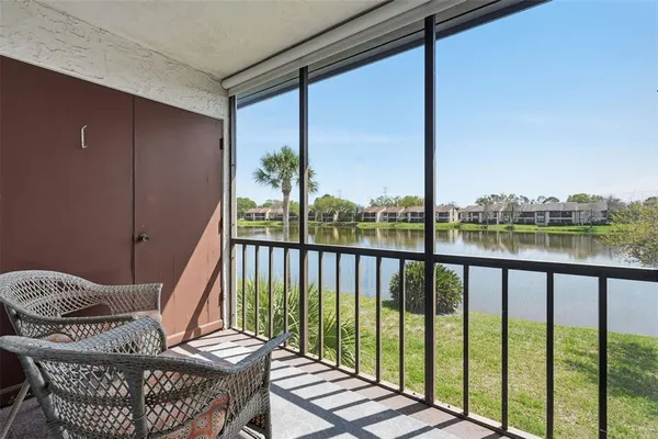 a view of balcony with furniture