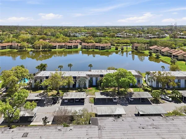 a aerial view of a house with a yard