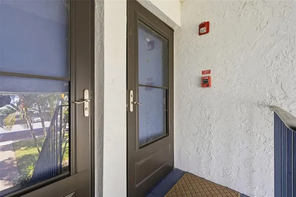 a bathroom with a shower and a door