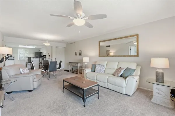 a living room with furniture and white walls
