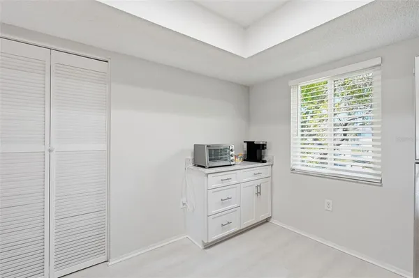 a room with a desk and a window