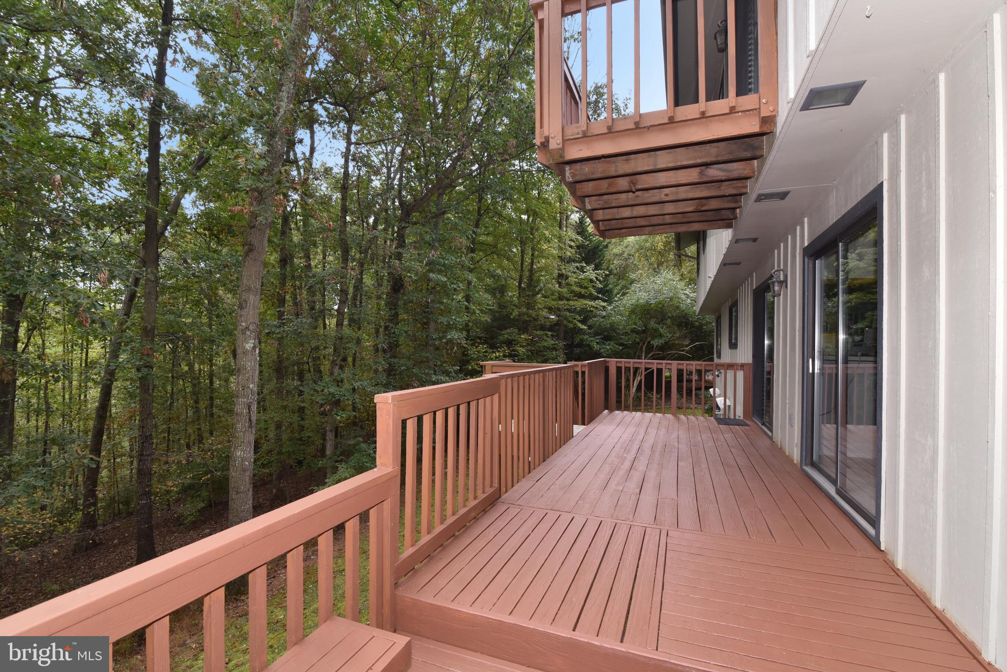 11117 Glade Drive Reston, VA 20191 - Photo 8 of 75 Spacious wrap-around deck overlooks the trees.