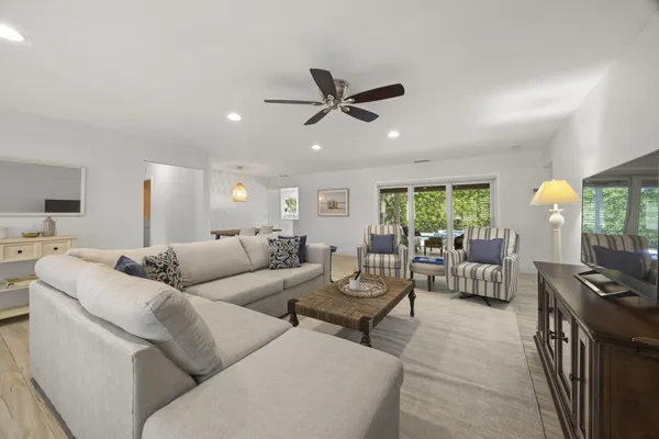 a living room with furniture and a window