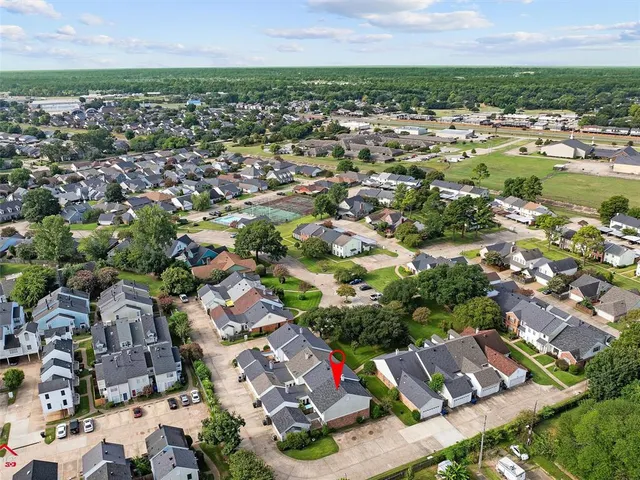 an aerial view of residential houses with outdoor space