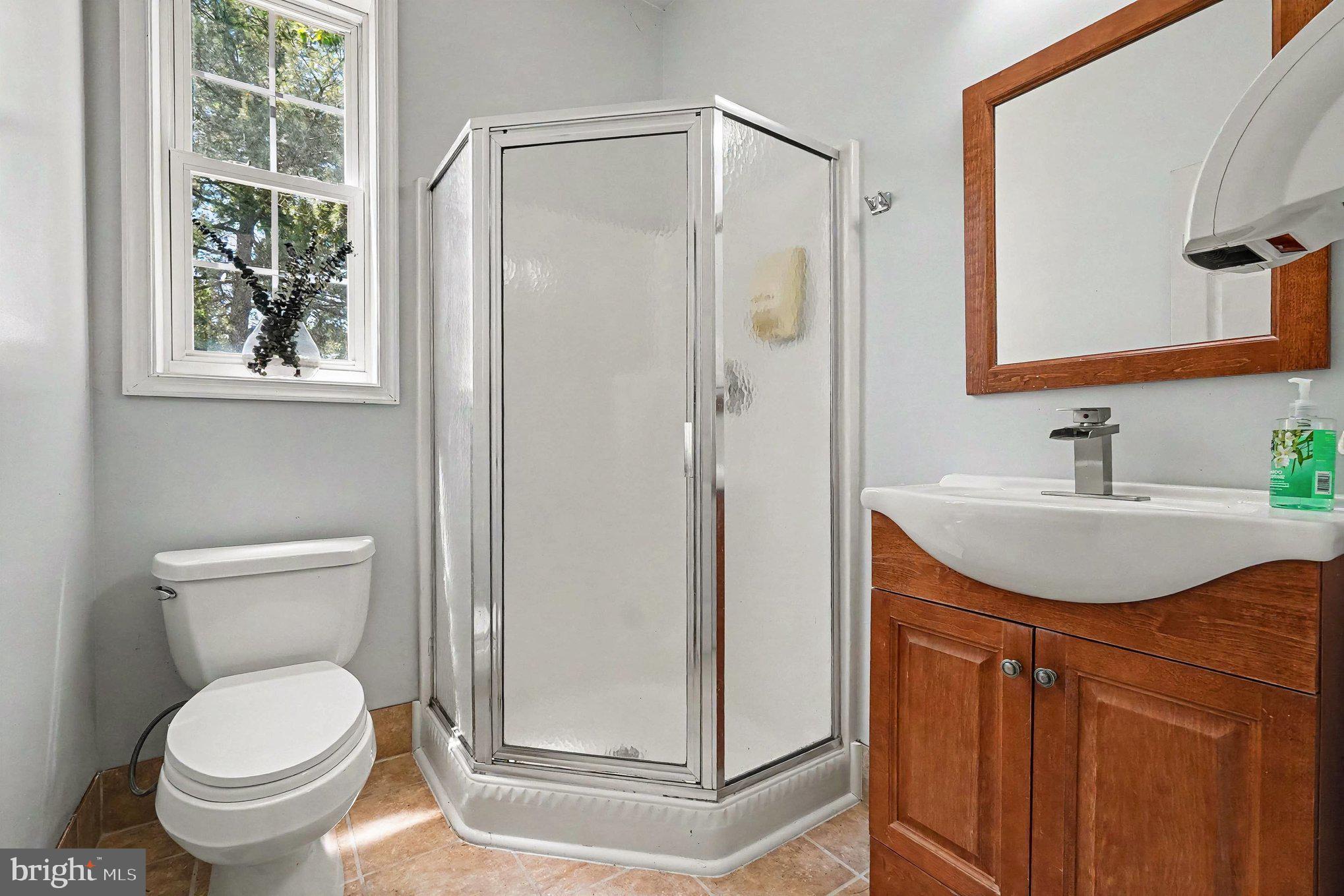 64 Open Meadow Court Elkton, MD 21921 - Photo 25 of 57 a bathroom with a granite countertop sink toilet and shower