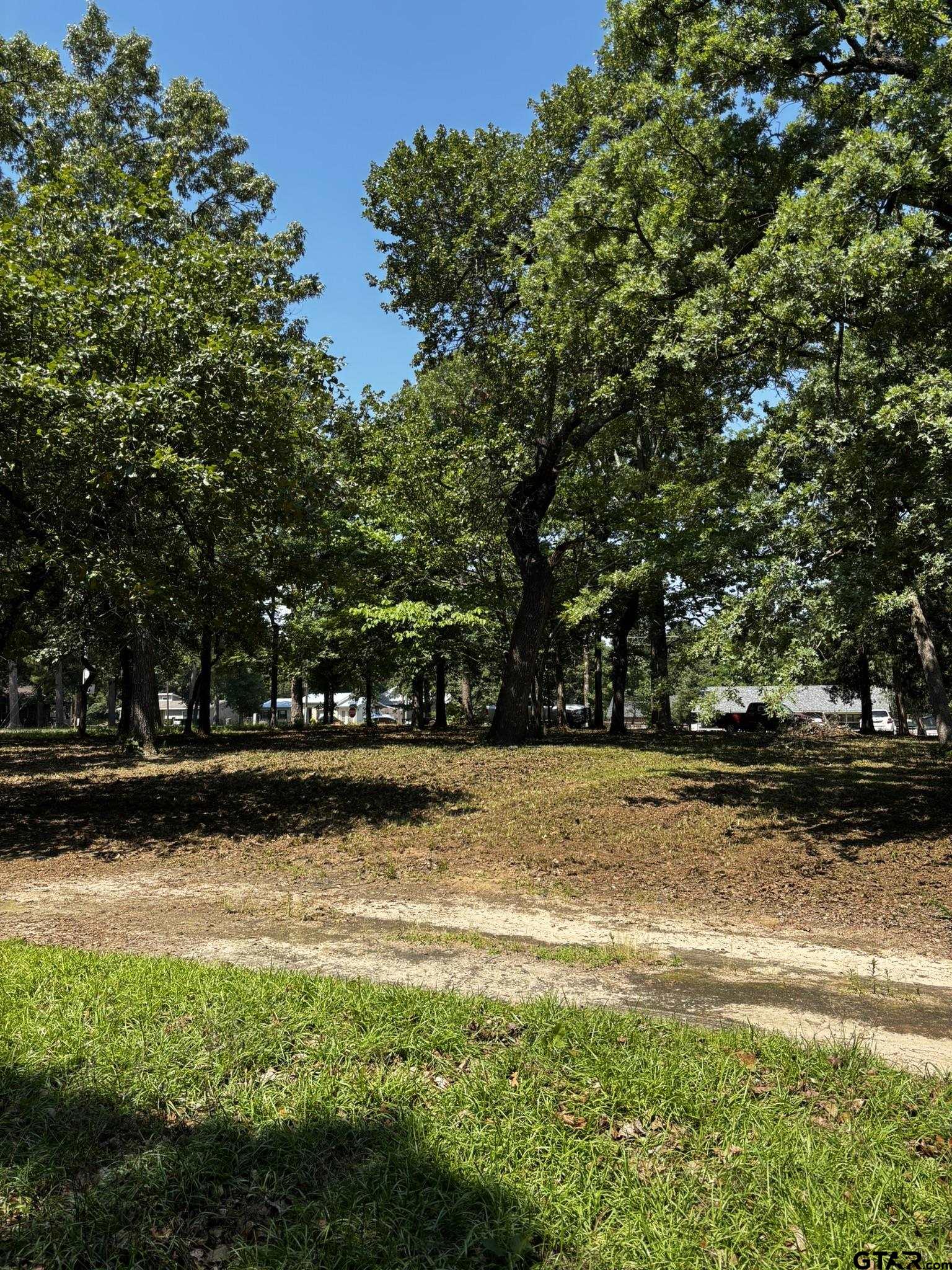 21047 Virginia Road Flint, TX 75762 - Photo 2 of 3 a view of a swimming pool with an outdoor space and seating area