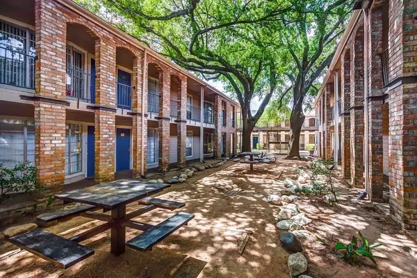 a view of a building with a tree