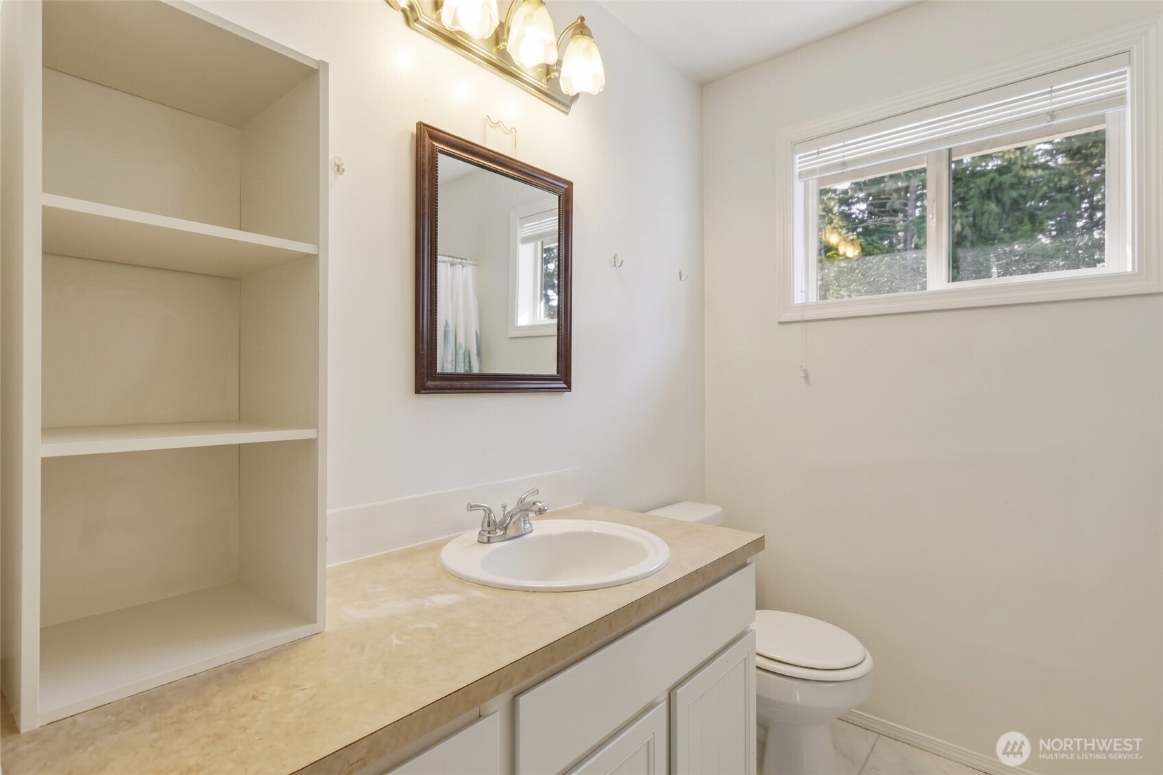 37214 Allen Road South Roy, WA 98580 - Photo 14 of 38 a bathroom with a sink toilet and a window