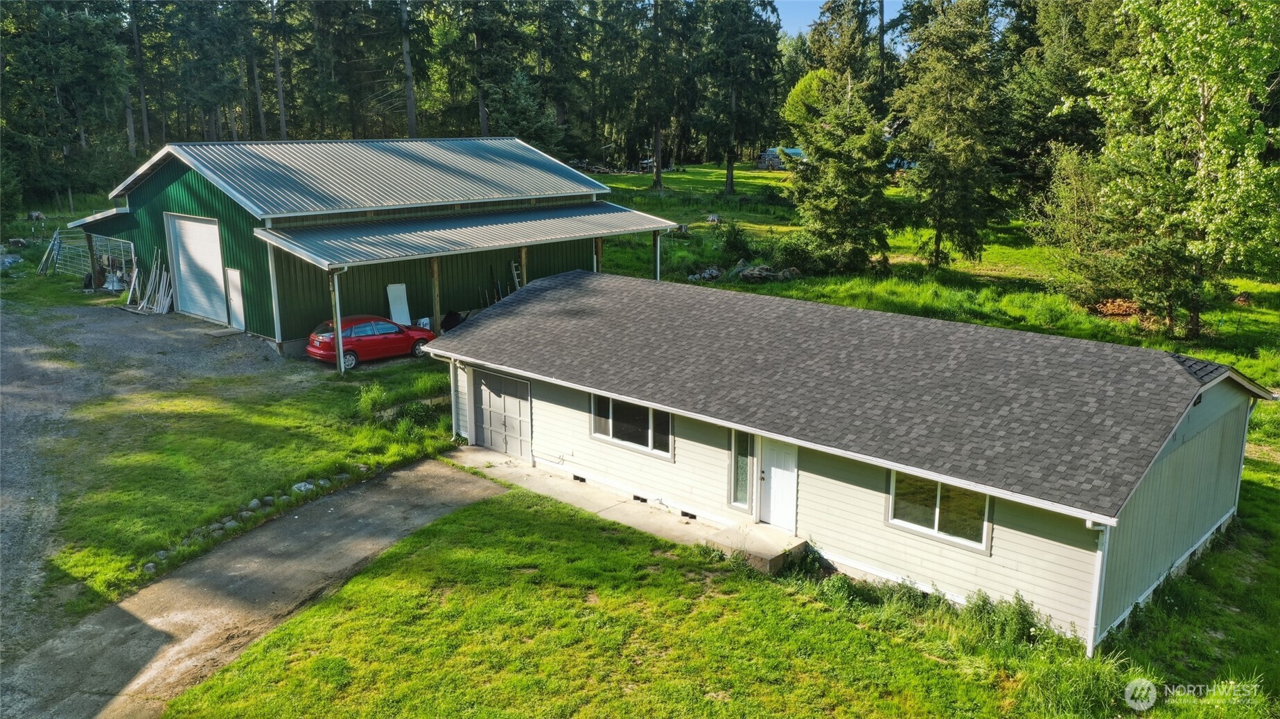37214 Allen Road South Roy, WA 98580 - Photo 2 of 38 a aerial view of a house with table and chairs under an umbrella
