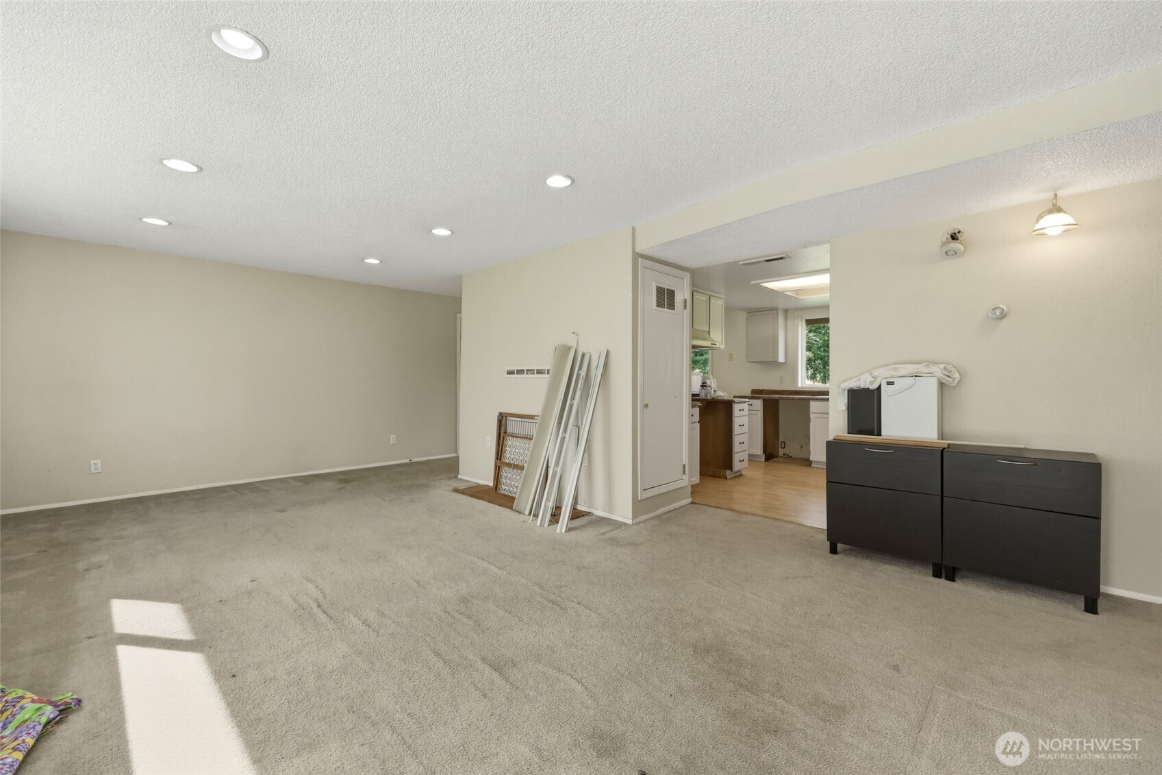 37214 Allen Road South Roy, WA 98580 - Photo 21 of 38 a living room with furniture and a refrigerator
