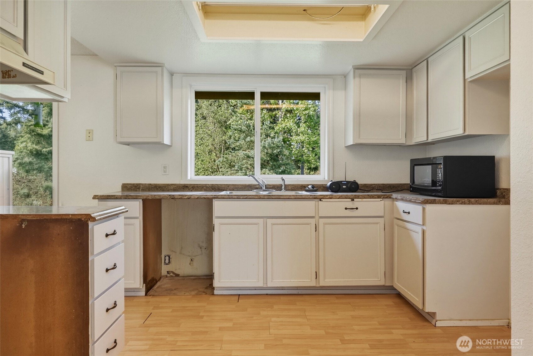 37214 Allen Road South Roy, WA 98580 - Photo 22 of 38 a kitchen with granite countertop a sink cabinets stainless steel appliances and a window