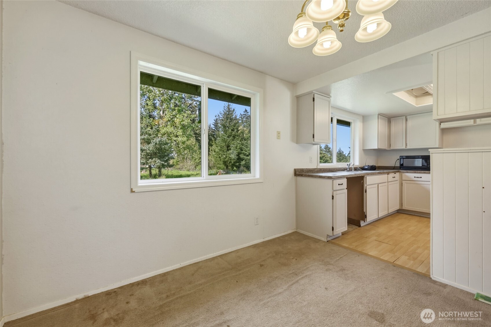 37214 Allen Road South Roy, WA 98580 - Photo 24 of 38 a kitchen with a refrigerator a sink dishwasher a stove and a window