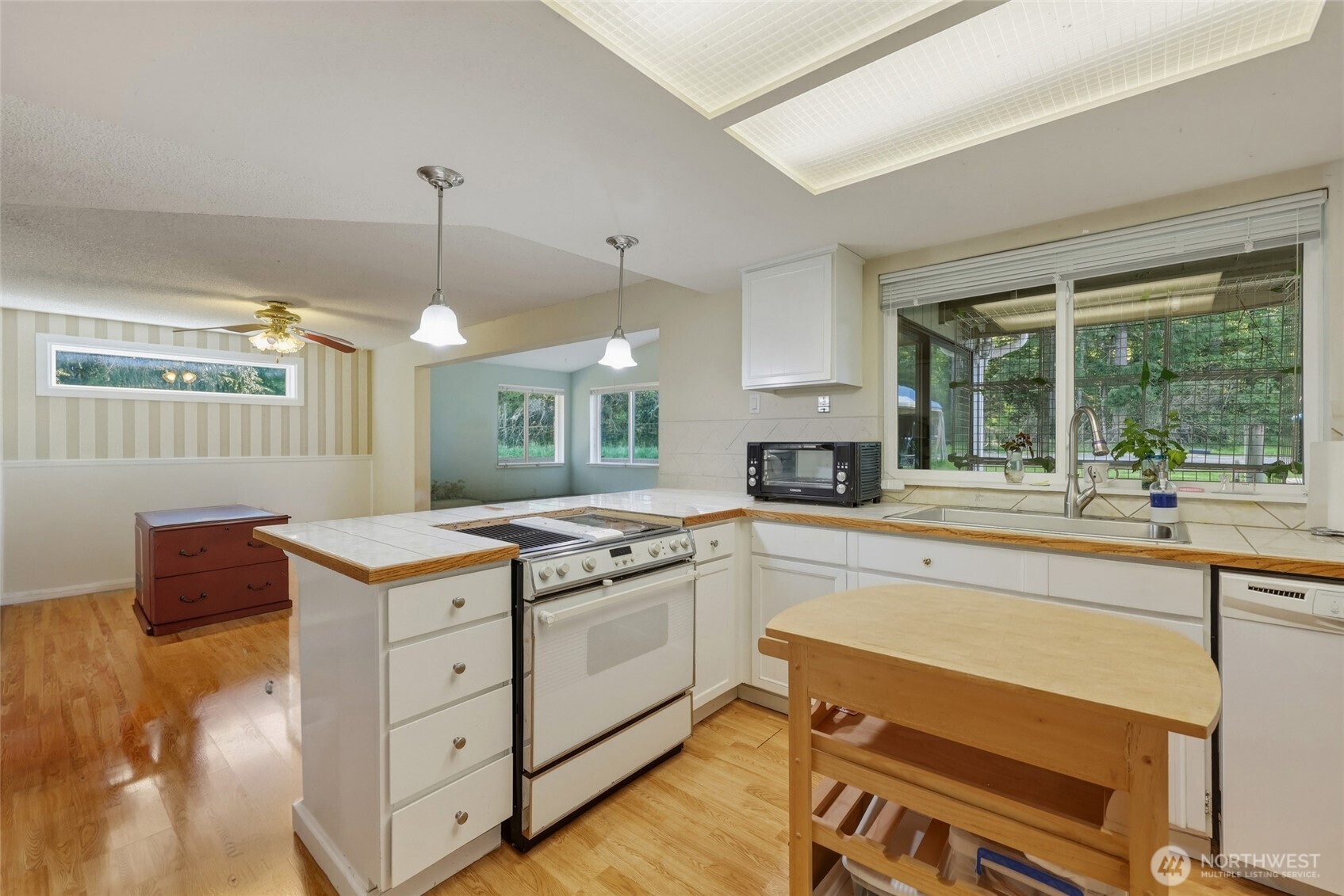 37214 Allen Road South Roy, WA 98580 - Photo 3 of 38 a kitchen with a stove a sink and a refrigerator
