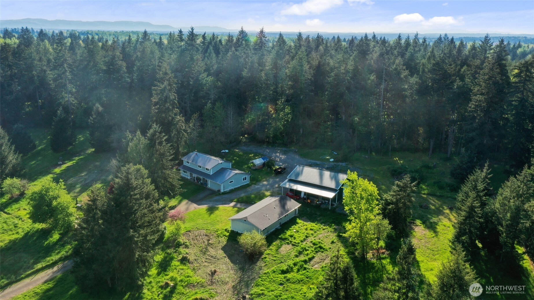37214 Allen Road South Roy, WA 98580 - Photo 38 of 38 a view of a garden with a bench