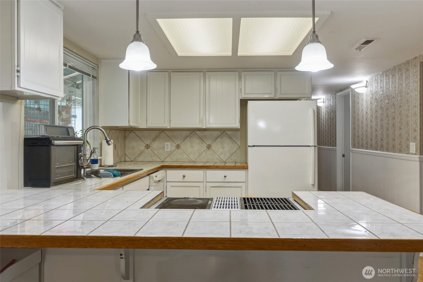 37214 Allen Road South Roy, WA 98580 - Photo 4 of 38 a kitchen with a sink a refrigerator and cabinets