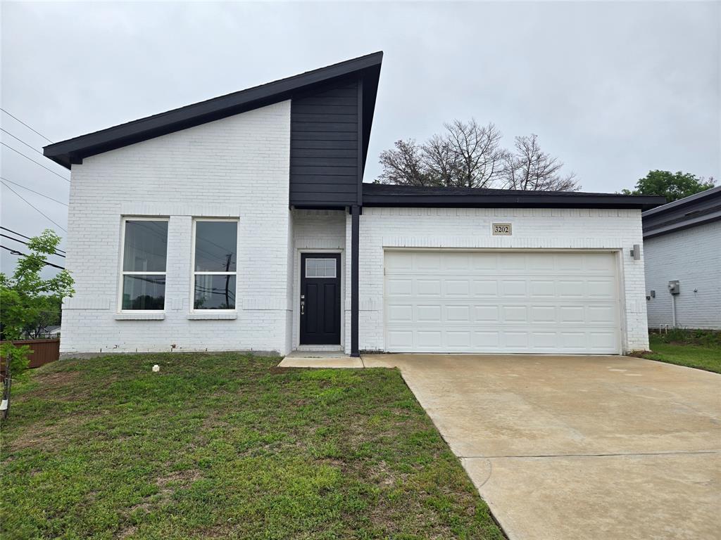 3202 Noor Street Dallas, TX 75233 - Photo 19 of 20 a front view of a house with a yard and garage