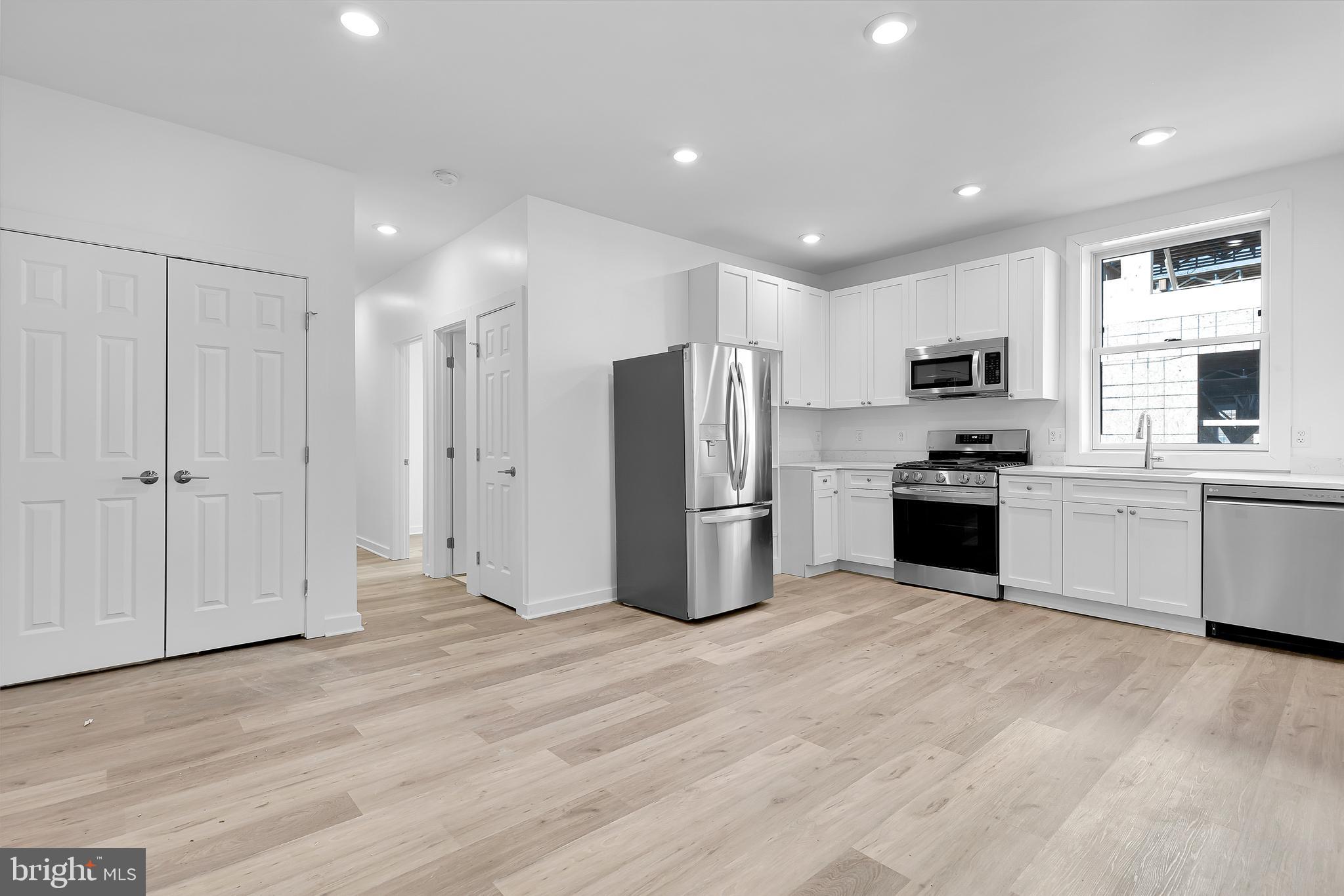1712 3rd Street Northwest Washington, DC 20001 - Photo 16 of 32 a kitchen with stainless steel appliances granite countertop a refrigerator and a sink