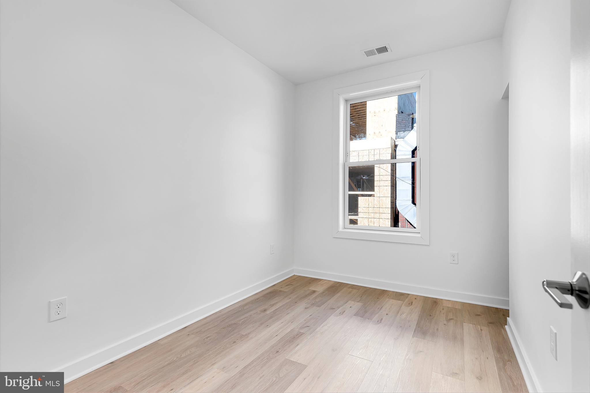 1712 3rd Street Northwest Washington, DC 20001 - Photo 21 of 32 a view of a small space with wooden floor and a window