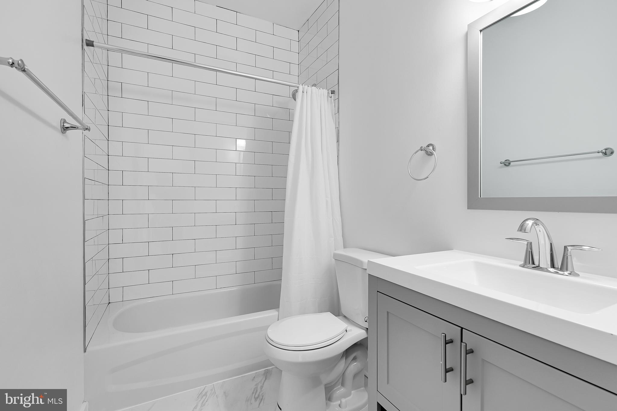1712 3rd Street Northwest Washington, DC 20001 - Photo 22 of 32 a bathroom with a sink toilet and shower