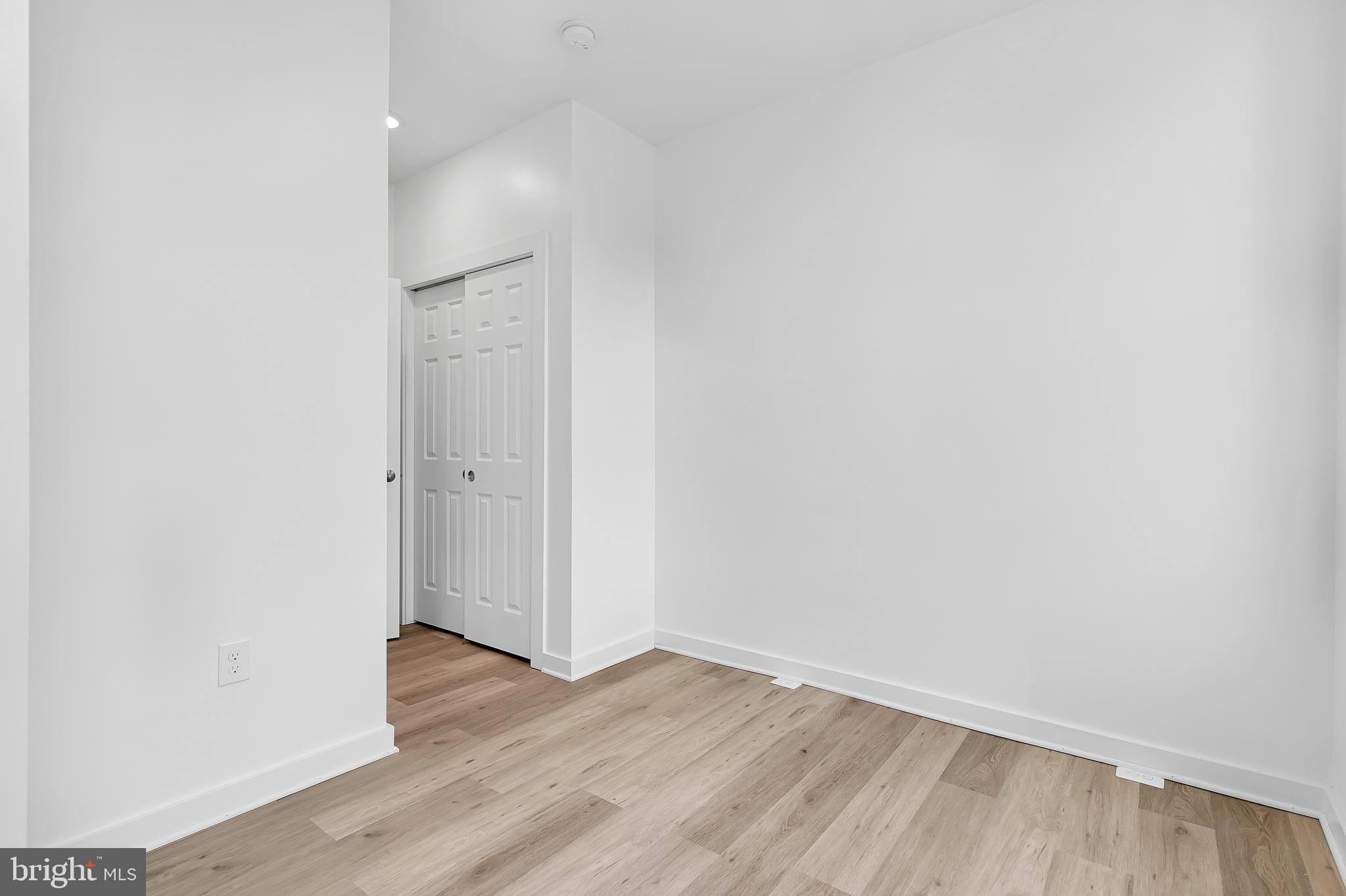 1712 3rd Street Northwest Washington, DC 20001 - Photo 27 of 32 an empty room with wooden floor