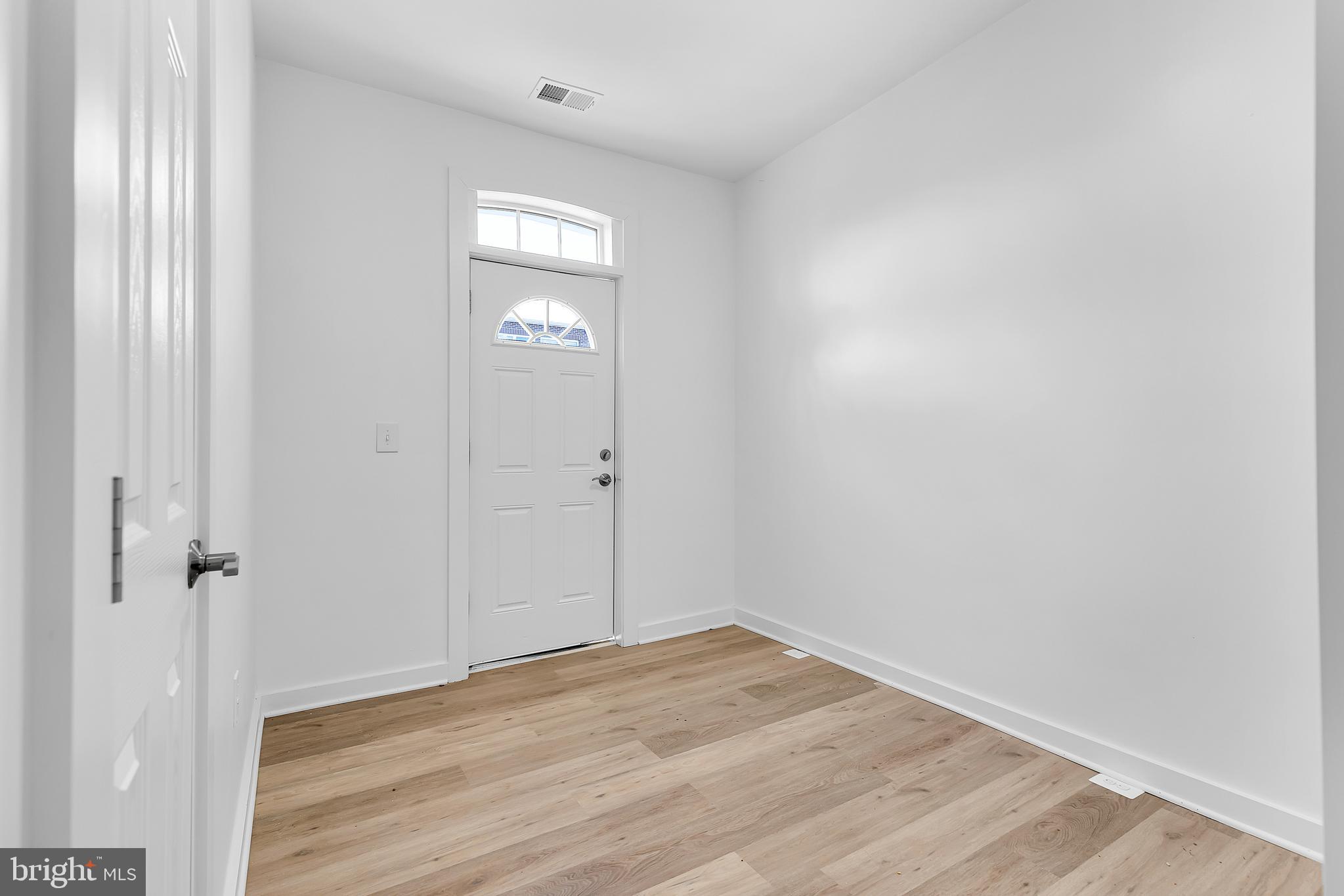 1712 3rd Street Northwest Washington, DC 20001 - Photo 28 of 32 an empty room with wooden floor and closet
