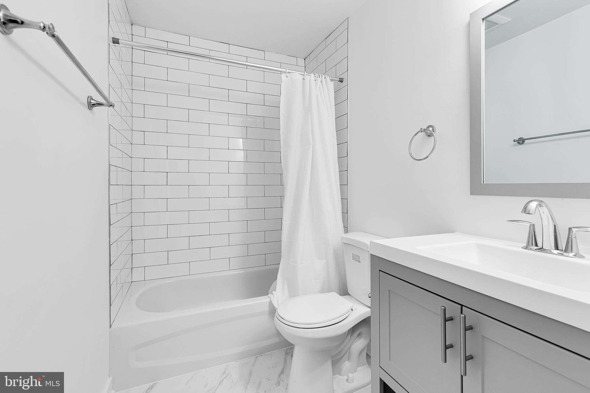 1712 3rd Street Northwest Washington, DC 20001 - Photo 10 of 32 a bathroom with a sink a toilet and shower