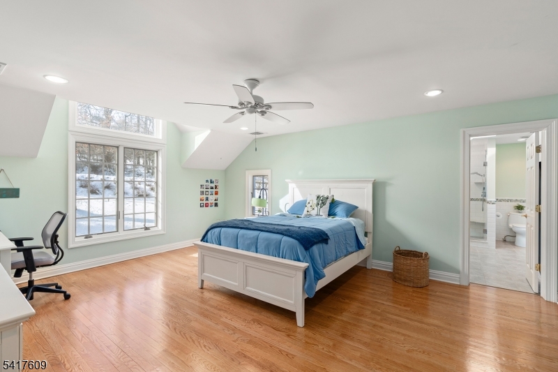 2 Cobblefield Road Mendham, NJ 07945 - Photo 29 of 50 a spacious bedroom with a bed and a table