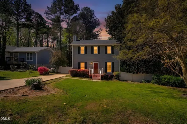 a view of a house with a yard porch and sitting area