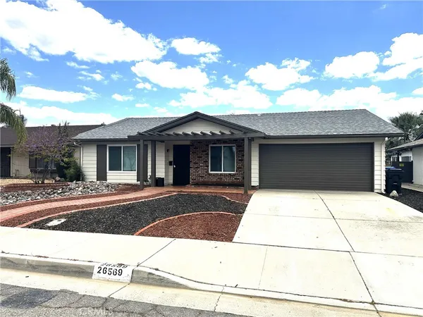 a front view of a house with garage