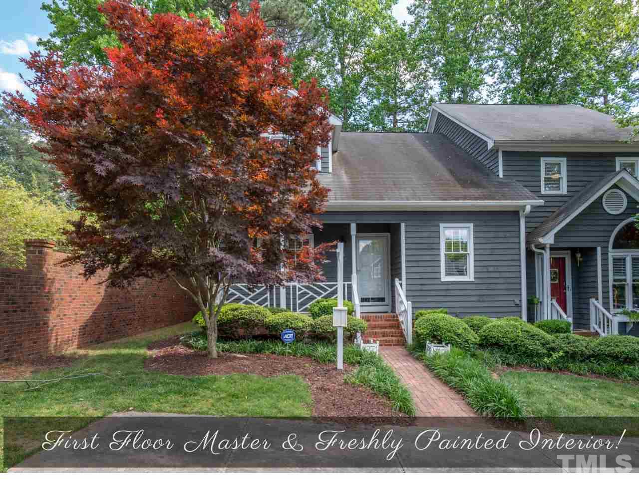 1401 Quarter Point Raleigh, NC 27615 - Photo 1 of 25 front view of house with a yard