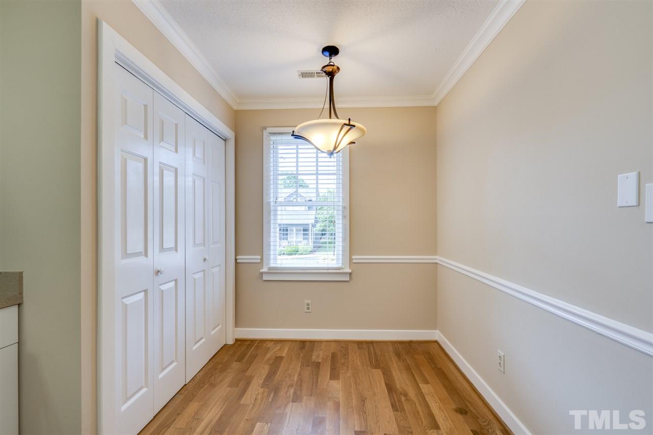 1401 Quarter Point Raleigh, NC 27615 - Photo 7 of 25 a view of an empty room with wooden floor and a window