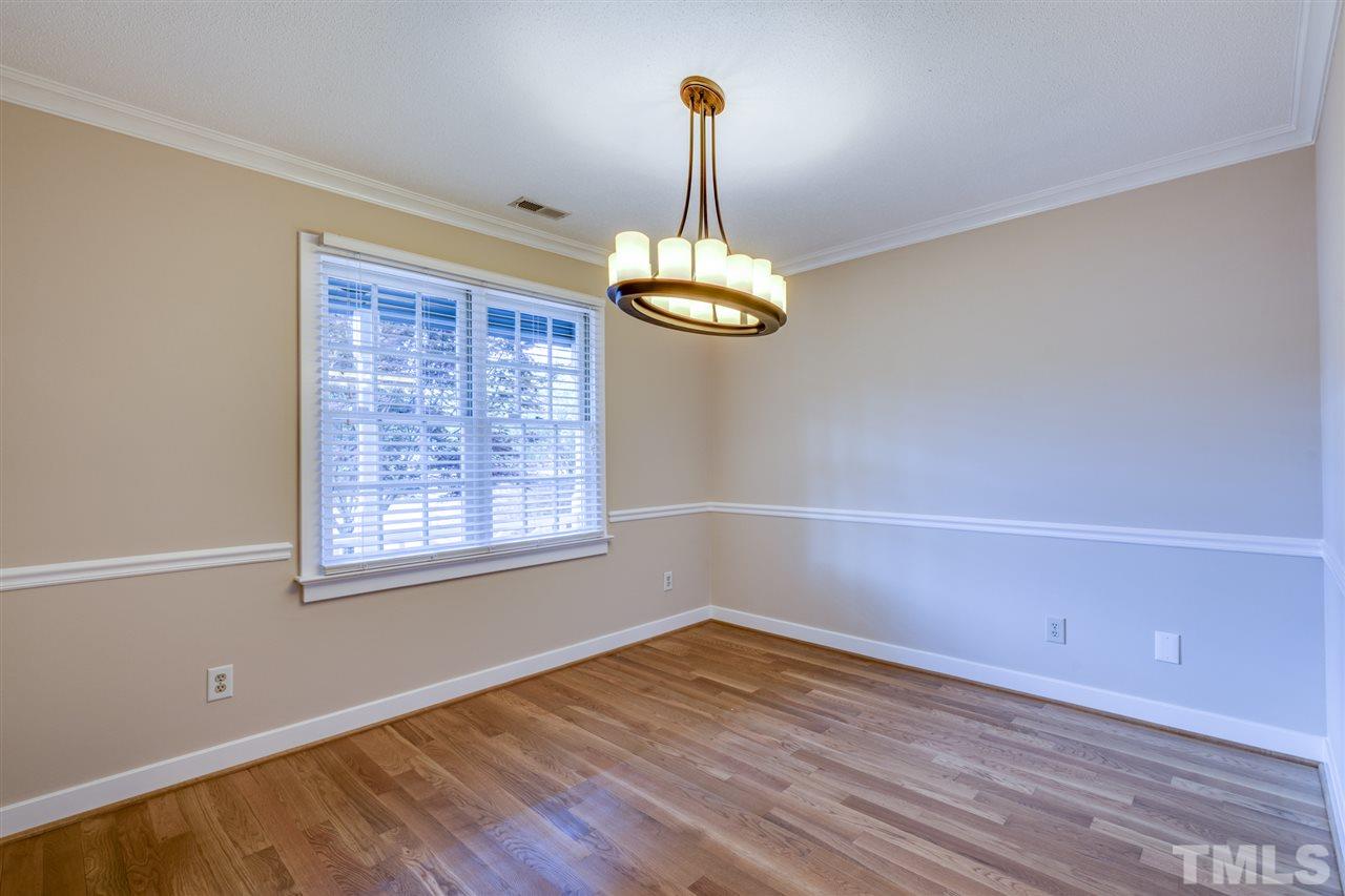1401 Quarter Point Raleigh, NC 27615 - Photo 9 of 25 wooden floor in an empty room with a window