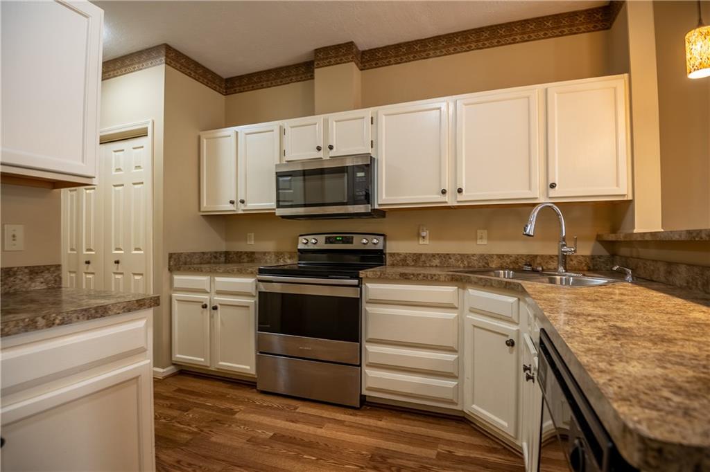 23 Stone Ridge Boulevard Hermitage, PA 16148 - Photo 9 of 23 a kitchen with a stove a sink and a microwave