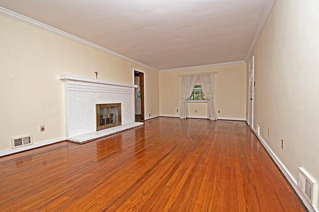 2854 Leechburg Road Lower Burrell, PA 15068 - Photo 15 of 25 Spacious living room with exposed hardwood flooring and gas fireplace.