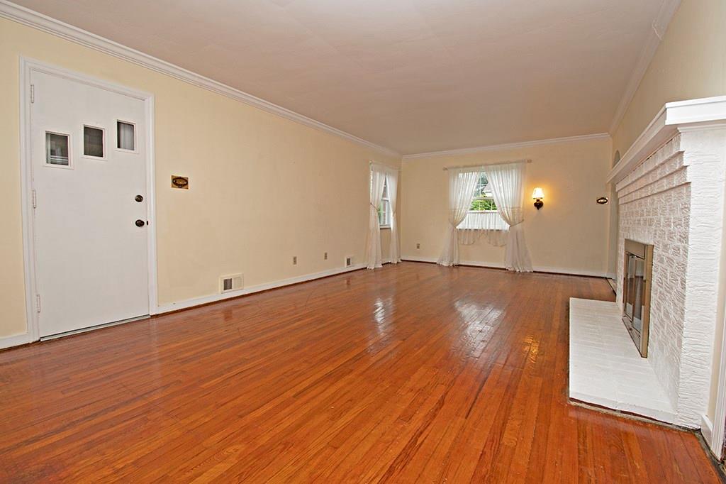 2854 Leechburg Road Lower Burrell, PA 15068 - Photo 16 of 25 Another view of the living room. The door leads to an enclosed porch.