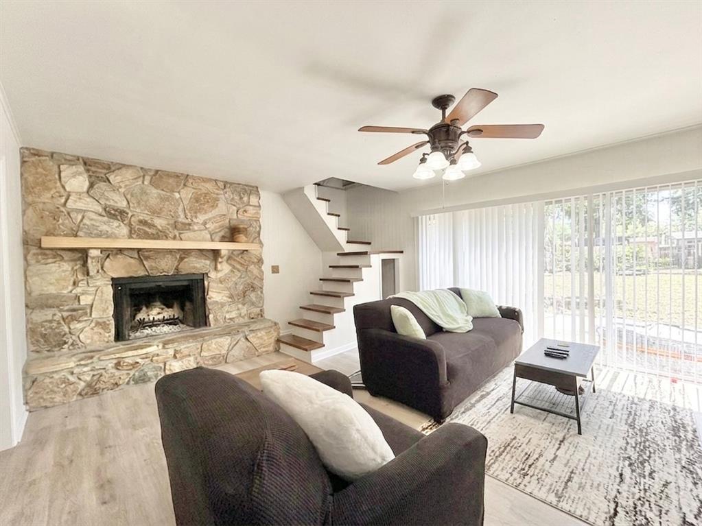 5846 Wyoming Avenue New Port Richey, FL 34652 - Photo 12 of 47 a living room with furniture and a fireplace