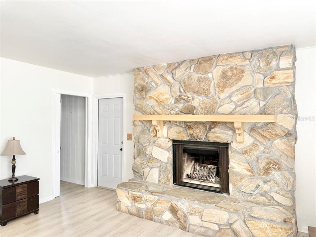 5846 Wyoming Avenue New Port Richey, FL 34652 - Photo 15 of 47 a living room with a fireplace