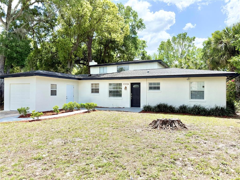 5846 Wyoming Avenue New Port Richey, FL 34652 - Photo 2 of 47 front view of house with a yard