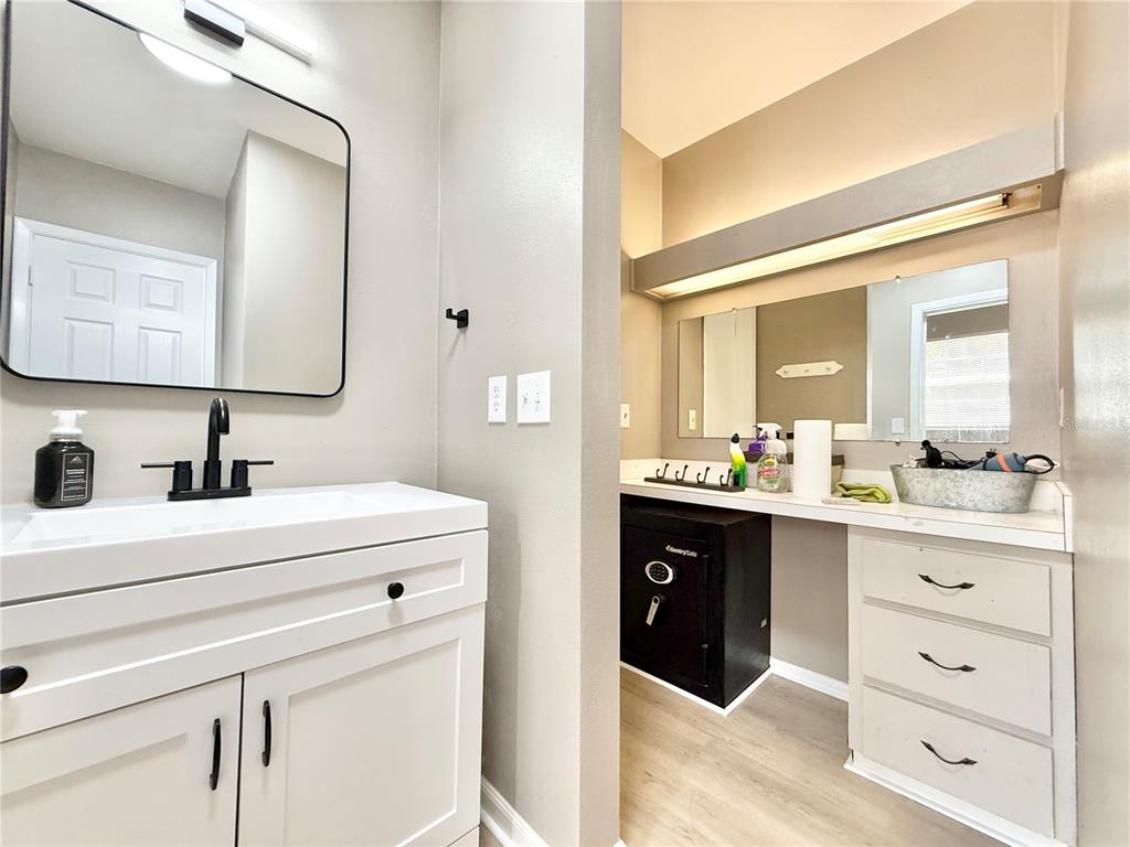 5846 Wyoming Avenue New Port Richey, FL 34652 - Photo 22 of 47 a spacious bathroom with a double vanity sink and mirror